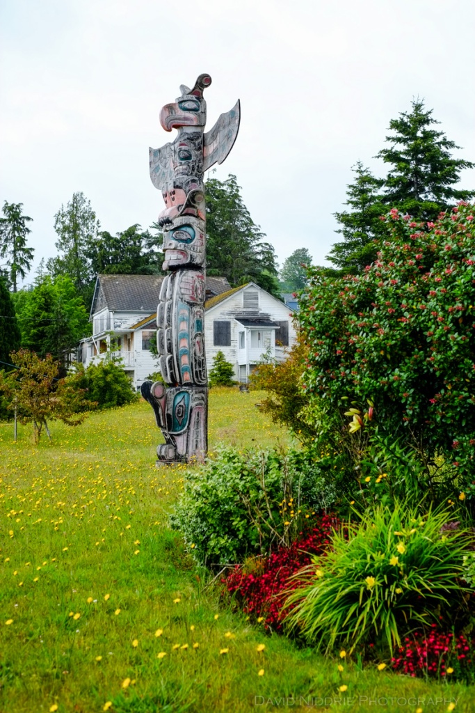 Totem poles stand tall at the traditional Namgis Burial Grounds on Alert Bay